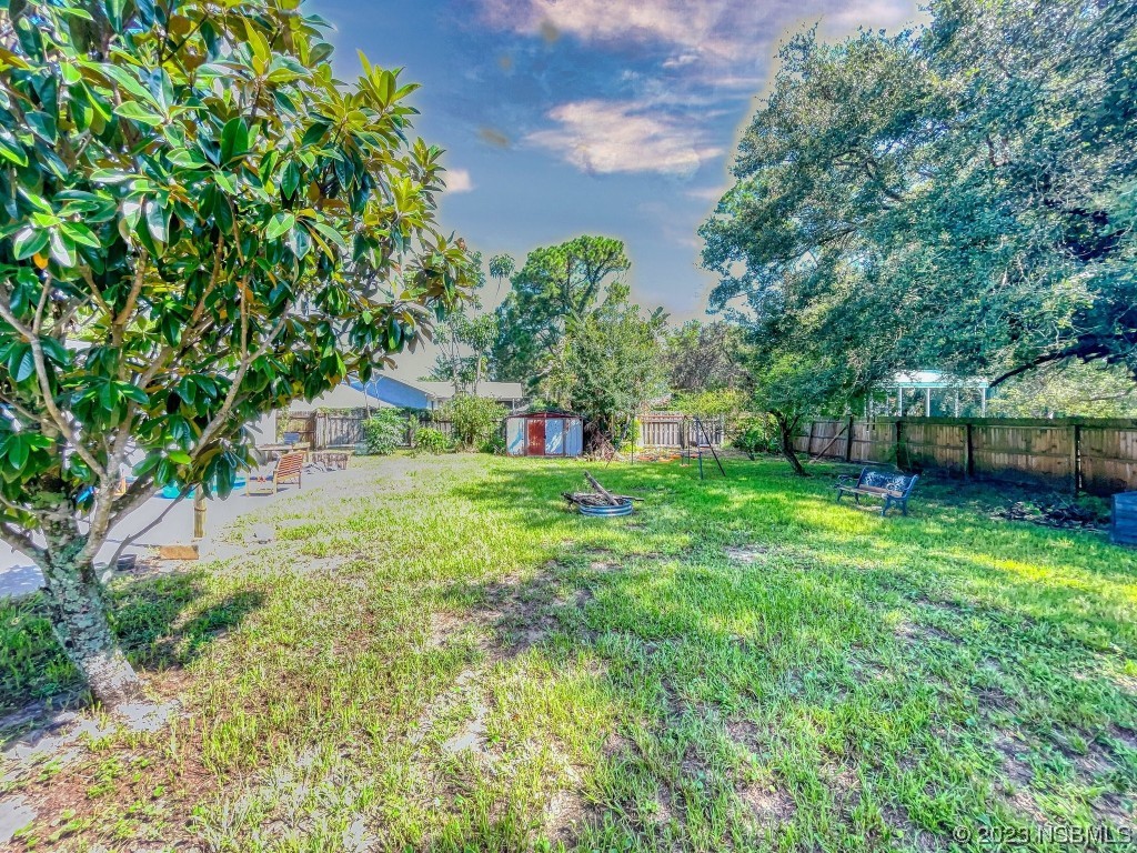 2761 Evergreen Drive Edgewater, FL 32141 - Photo 55 of 61 a view of a house with a backyard
