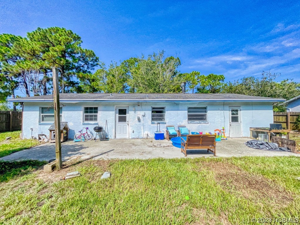 2761 Evergreen Drive Edgewater, FL 32141 - Photo 60 of 61 a backyard of a house with seating space