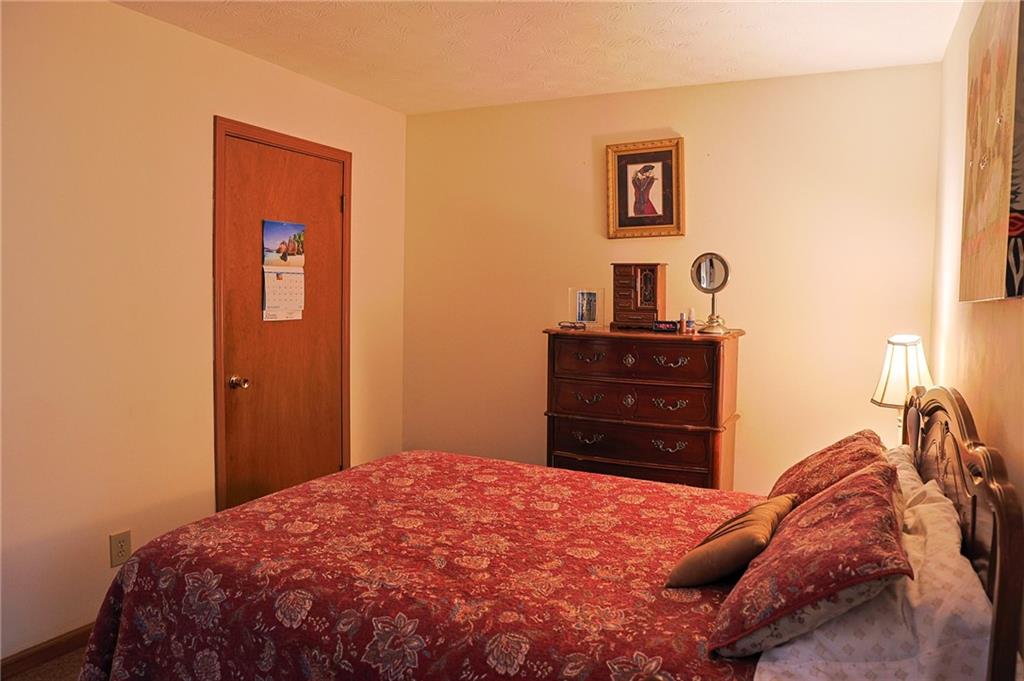 179 College Street Luthersville, GA 30251 - Photo 13 of 26 a bedroom with a bed and dresser