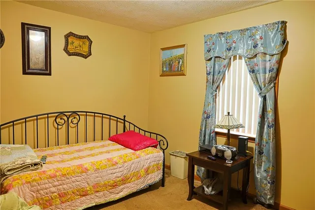 a bedroom with a bed and a table in it