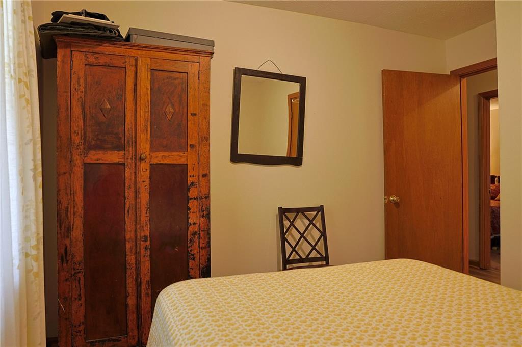 179 College Street Luthersville, GA 30251 - Photo 19 of 26 a bedroom with a bed and cabinets