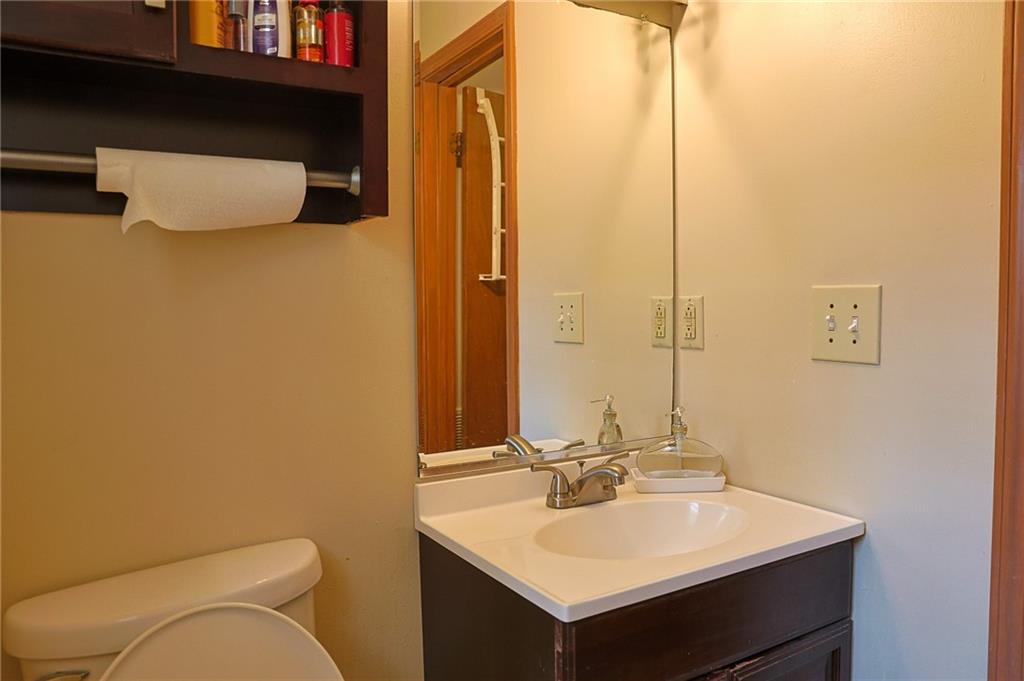 179 College Street Luthersville, GA 30251 - Photo 21 of 26 a bathroom with a sink a toilet and mirror