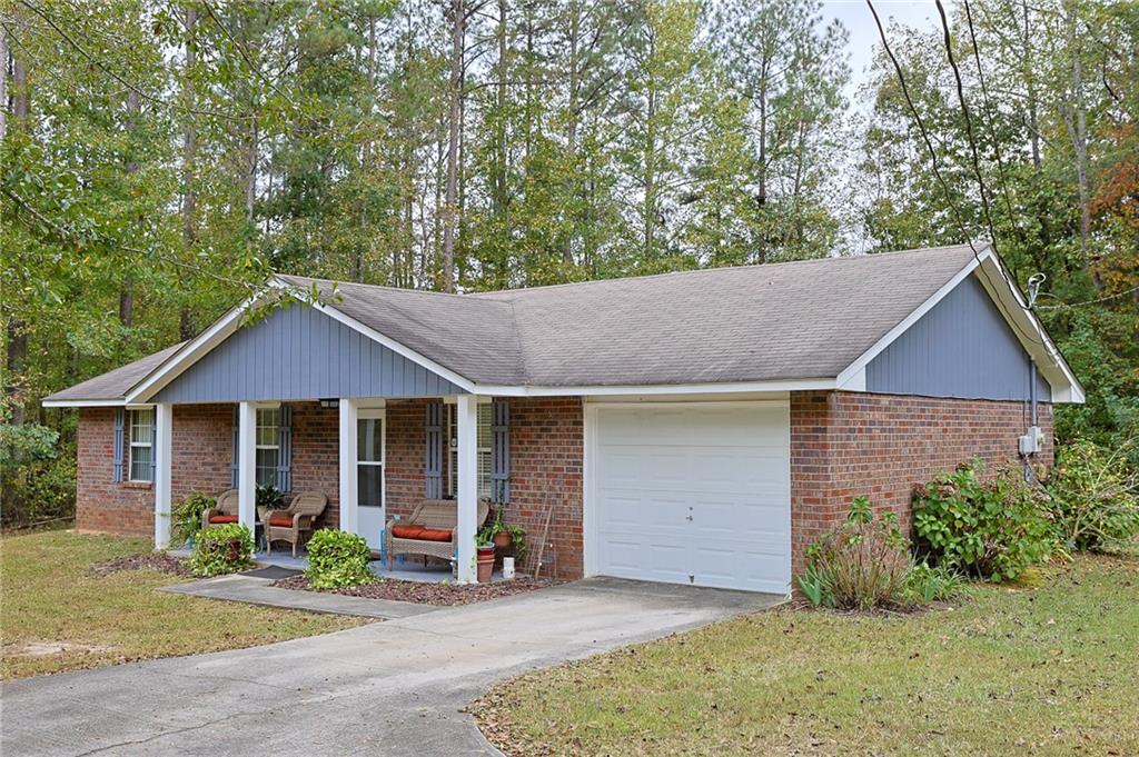 179 College Street Luthersville, GA 30251 - Photo 3 of 26 a front view of a house with garden