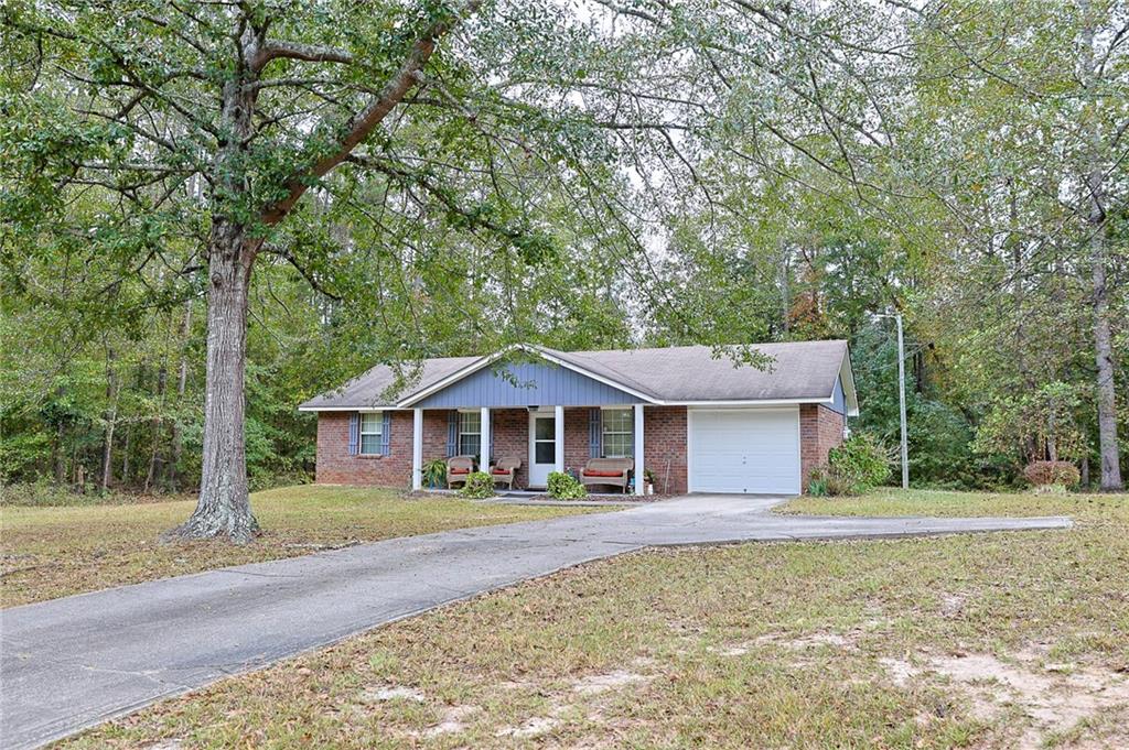 179 College Street Luthersville, GA 30251 - Photo 4 of 26 a house with trees in the background