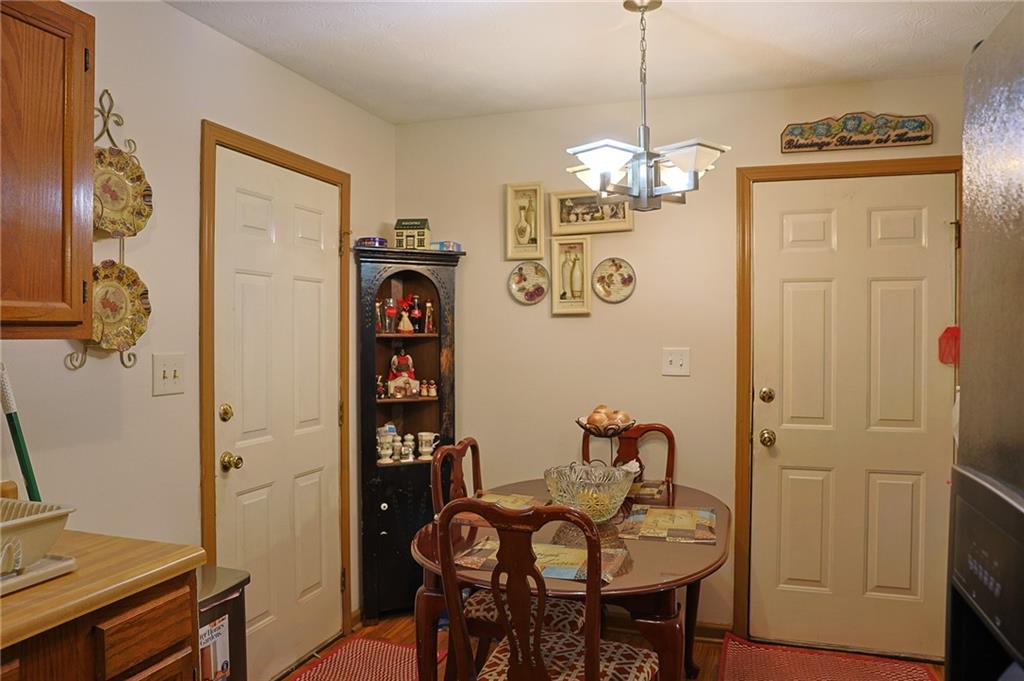 179 College Street Luthersville, GA 30251 - Photo 7 of 26 a view of a dining room with furniture wooden floor and a chandelier
