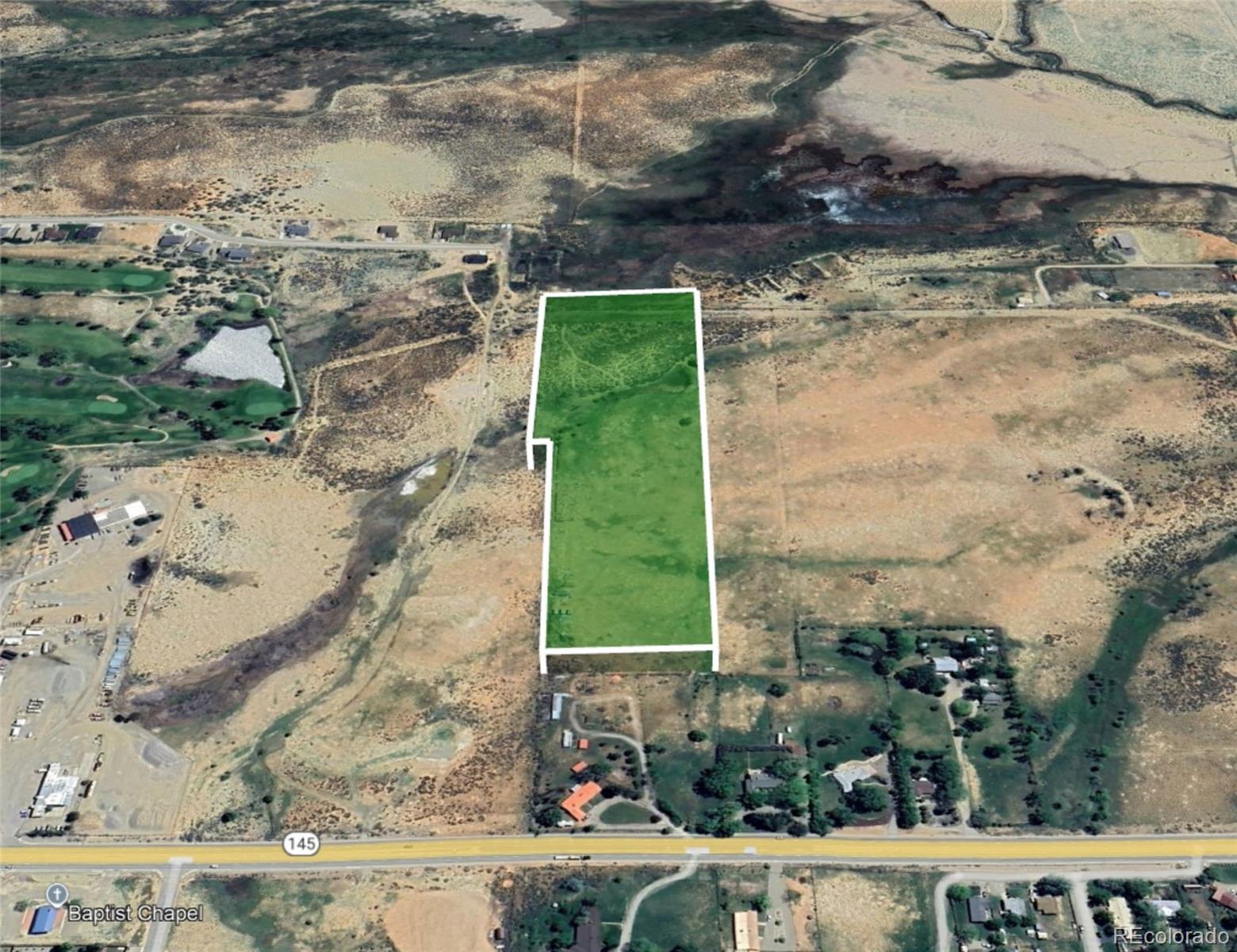 1400 North Dolores Road Cortez, CO 81321 - Photo 3 of 6 a view of a yard with an outdoor space