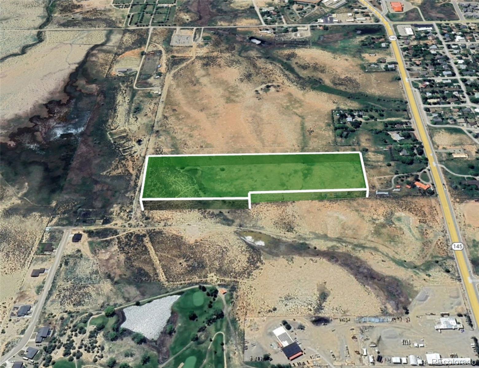 1400 North Dolores Road Cortez, CO 81321 - Photo 4 of 6 an aerial view of a house