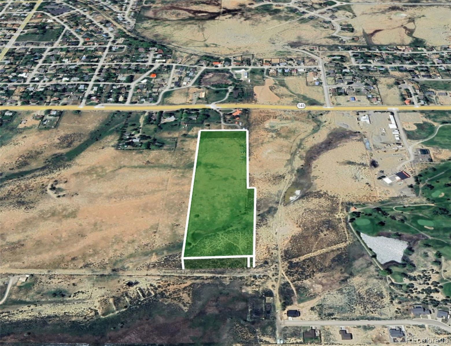 1400 North Dolores Road Cortez, CO 81321 - Photo 5 of 6 a view of a yard