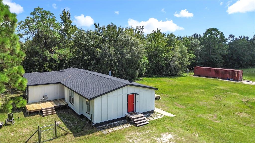 18604 Belvedere Road Orlando, FL 32820 - Photo 2 of 50 a view of a house with a yard