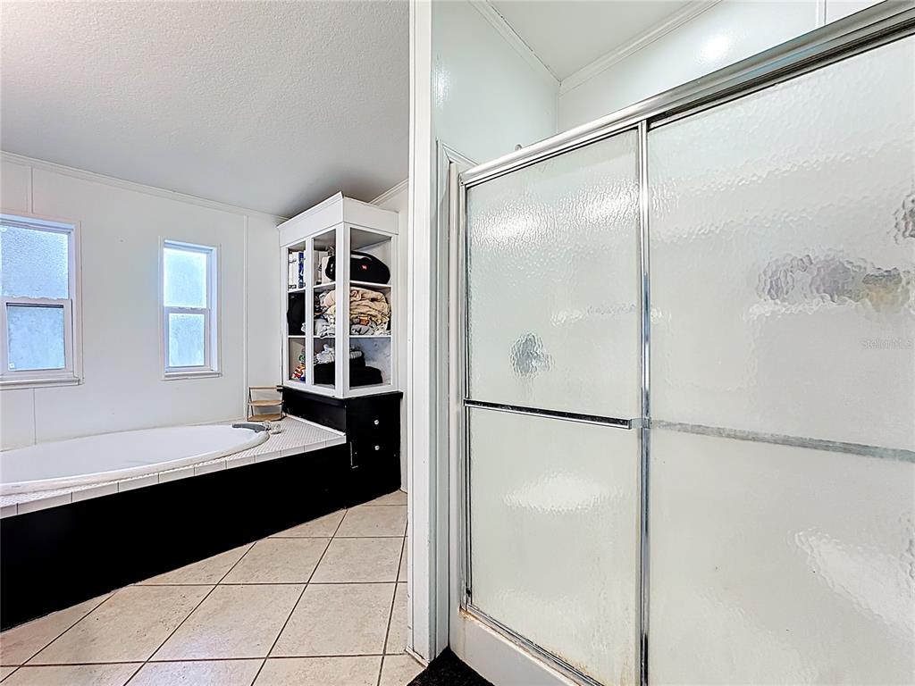 18604 Belvedere Road Orlando, FL 32820 - Photo 24 of 50 a kitchen with a refrigerator and a sink