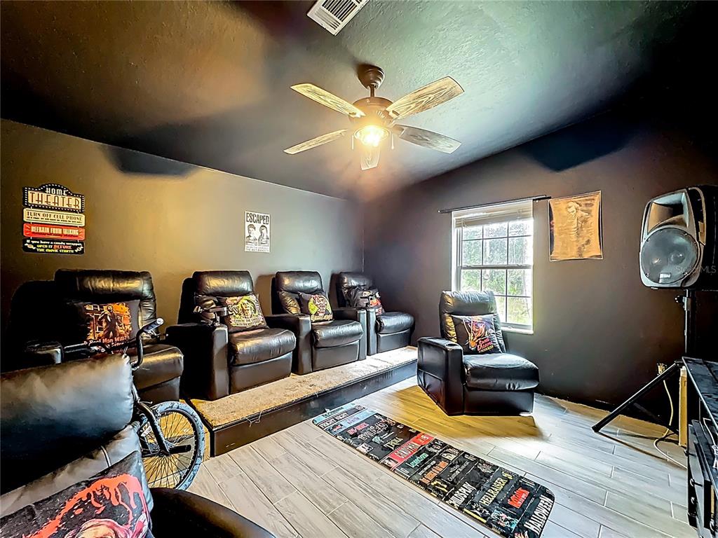 18604 Belvedere Road Orlando, FL 32820 - Photo 34 of 50 a living room with furniture a rug and a window