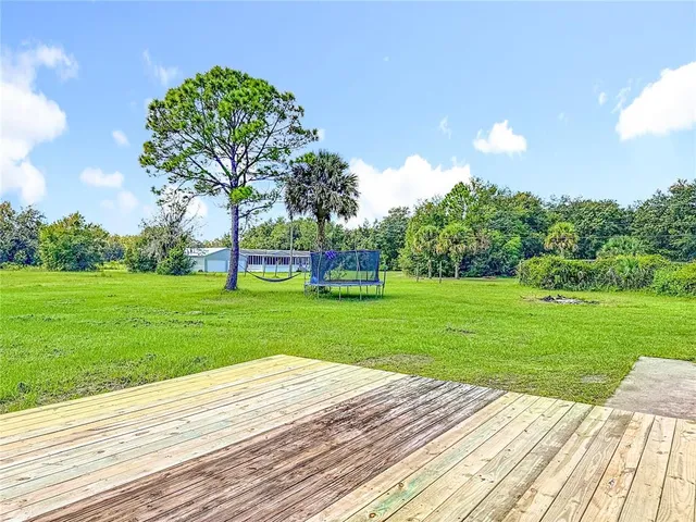 a view of swimming pool from a yard