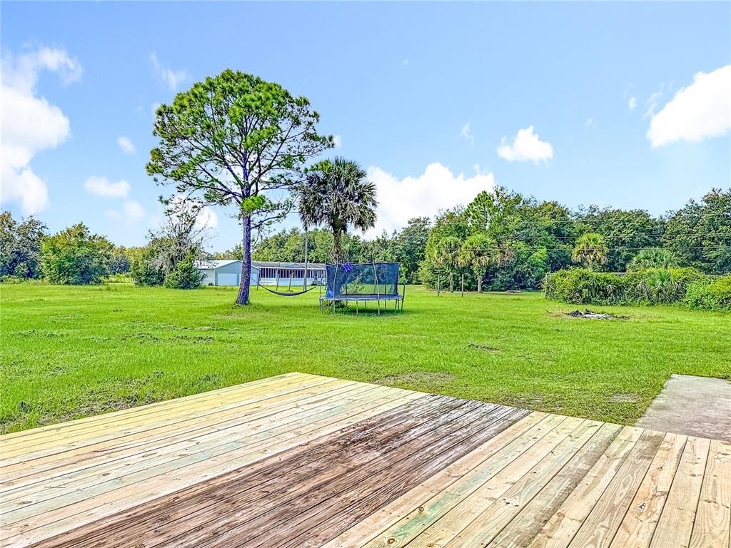 18604 Belvedere Road Orlando, FL 32820 - Photo 40 of 50 a front view of a house with garden