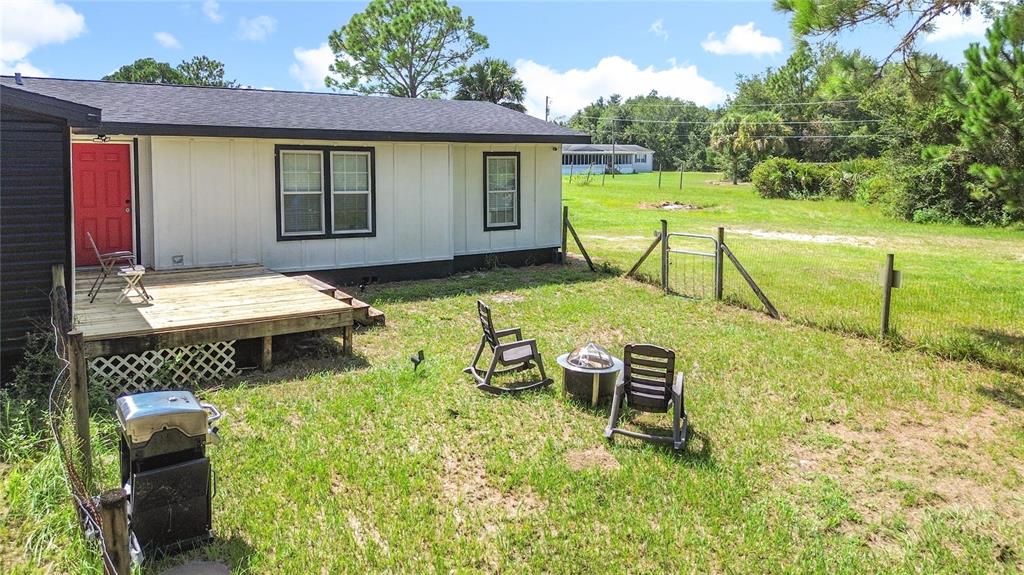18604 Belvedere Road Orlando, FL 32820 - Photo 4 of 50 a view of a house with backyard