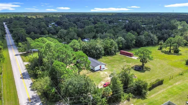 a view of a lake with a yard