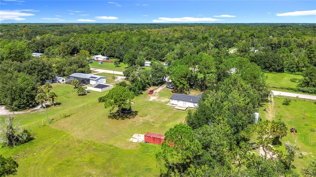 18604 Belvedere Road Orlando, FL 32820 - Photo 44 of 50 a view of a lake with a yard