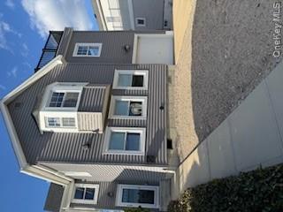 733 East Walnut Street, Unit UPPR Long Beach, NY 11561 - Photo 22 of 26 a house that has a large window in it