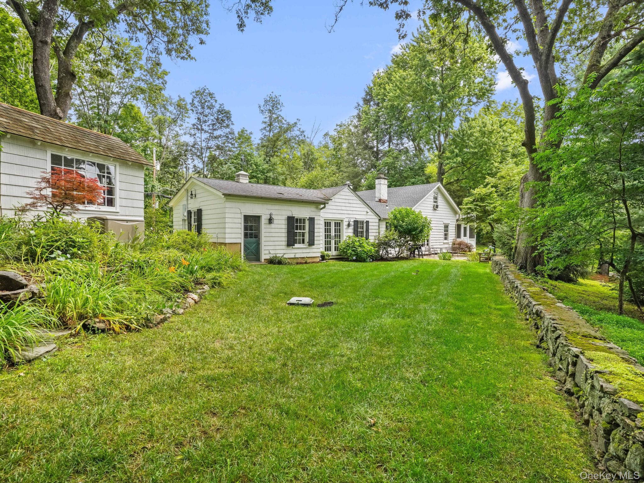 8 South Bedford Road Pound Ridge, NY 10576 - Photo 6 of 32 a front view of house with yard and green space