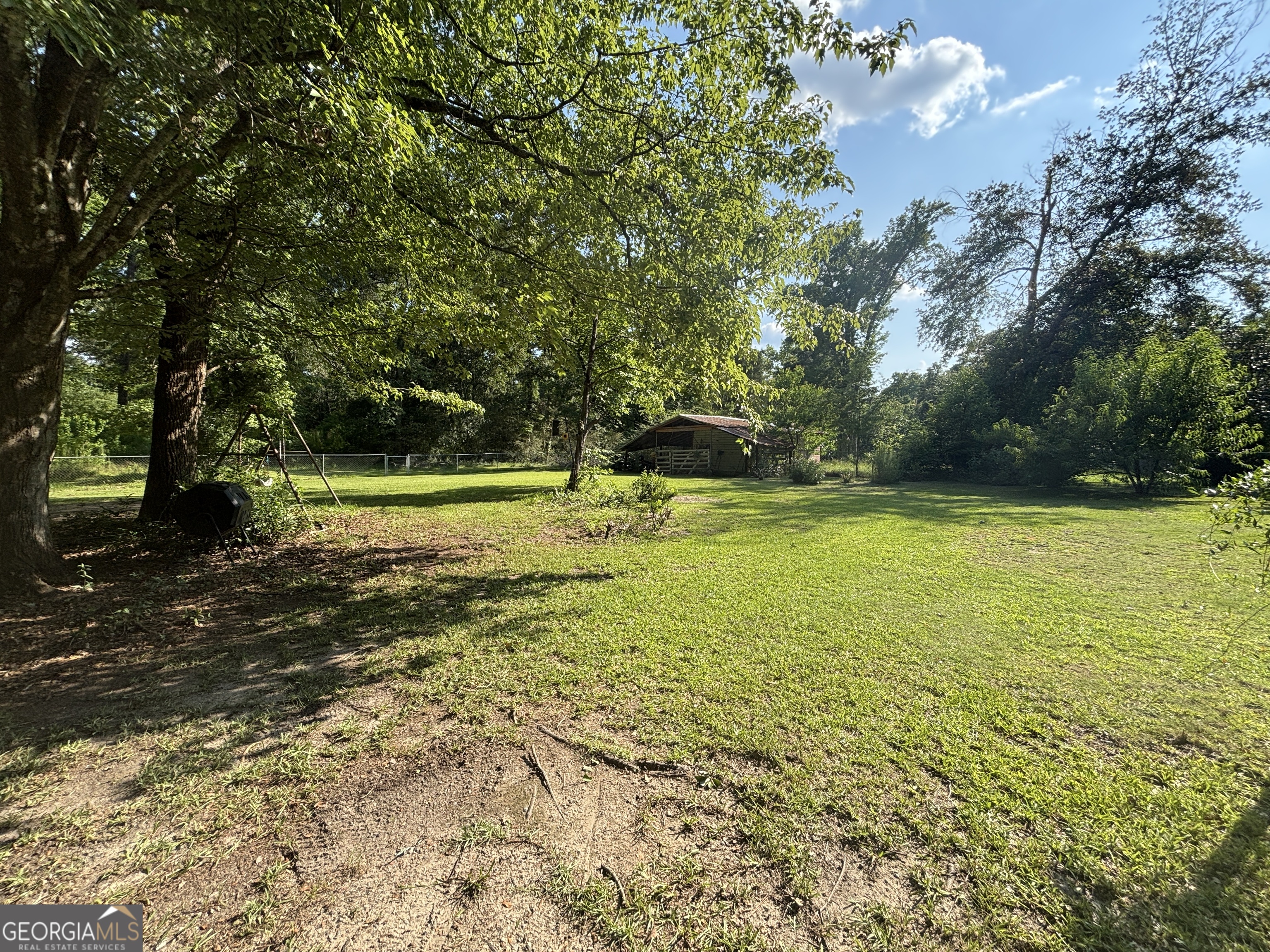 152 Crest Drive Cochran, GA 31014 - Photo 49 of 54 a view of a yard with a trees