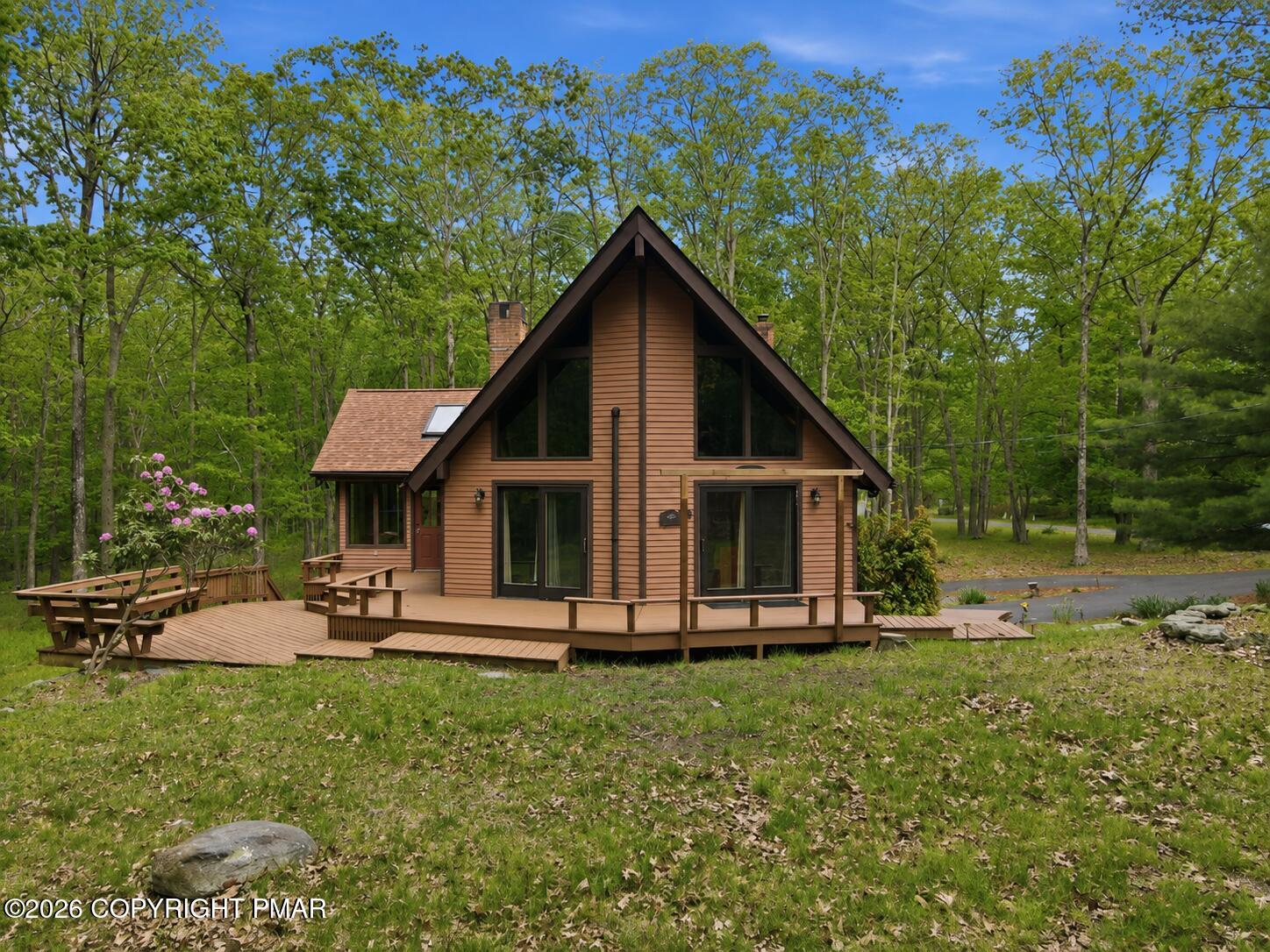 1517 Deer Run East Bushkill, PA 18324 - Photo 2 of 42 a front view of a house with a yard