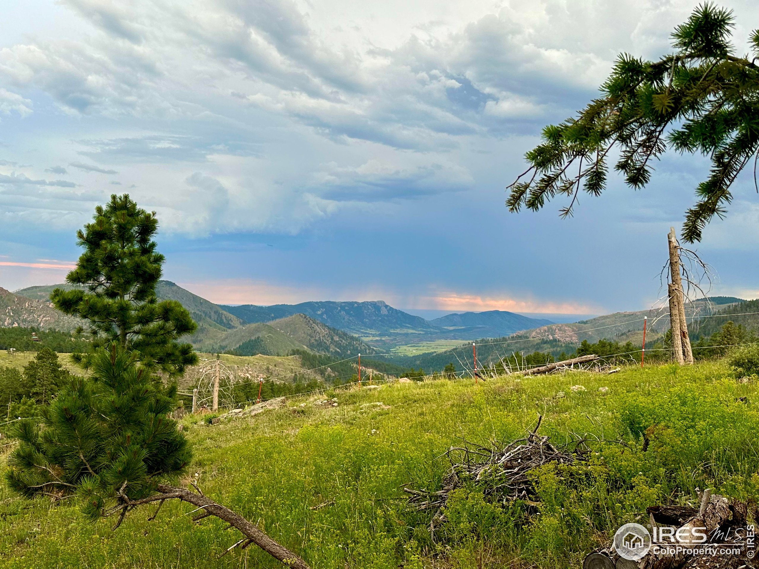 3235 Davis Ranch Road Bellvue, CO 80512 - Photo 16 of 38 a view of an lake and mountain