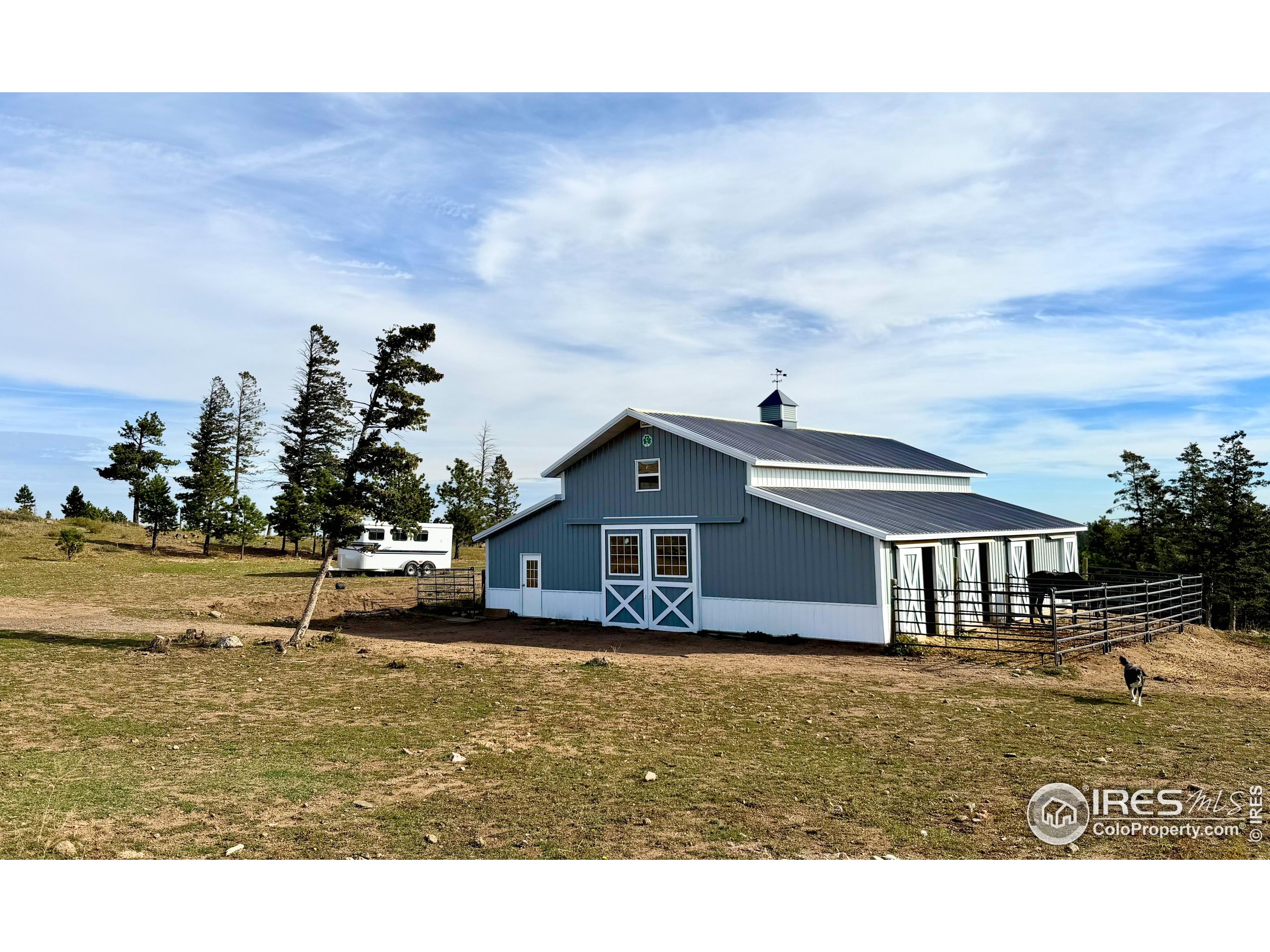3235 Davis Ranch Road Bellvue, CO 80512 - Photo 28 of 38 a front view of a house with a yard