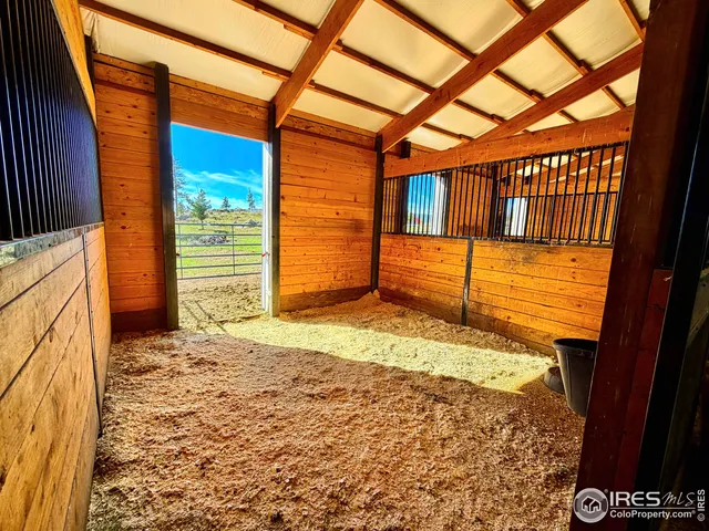 a view of a large body of water with lots of mountains in the background