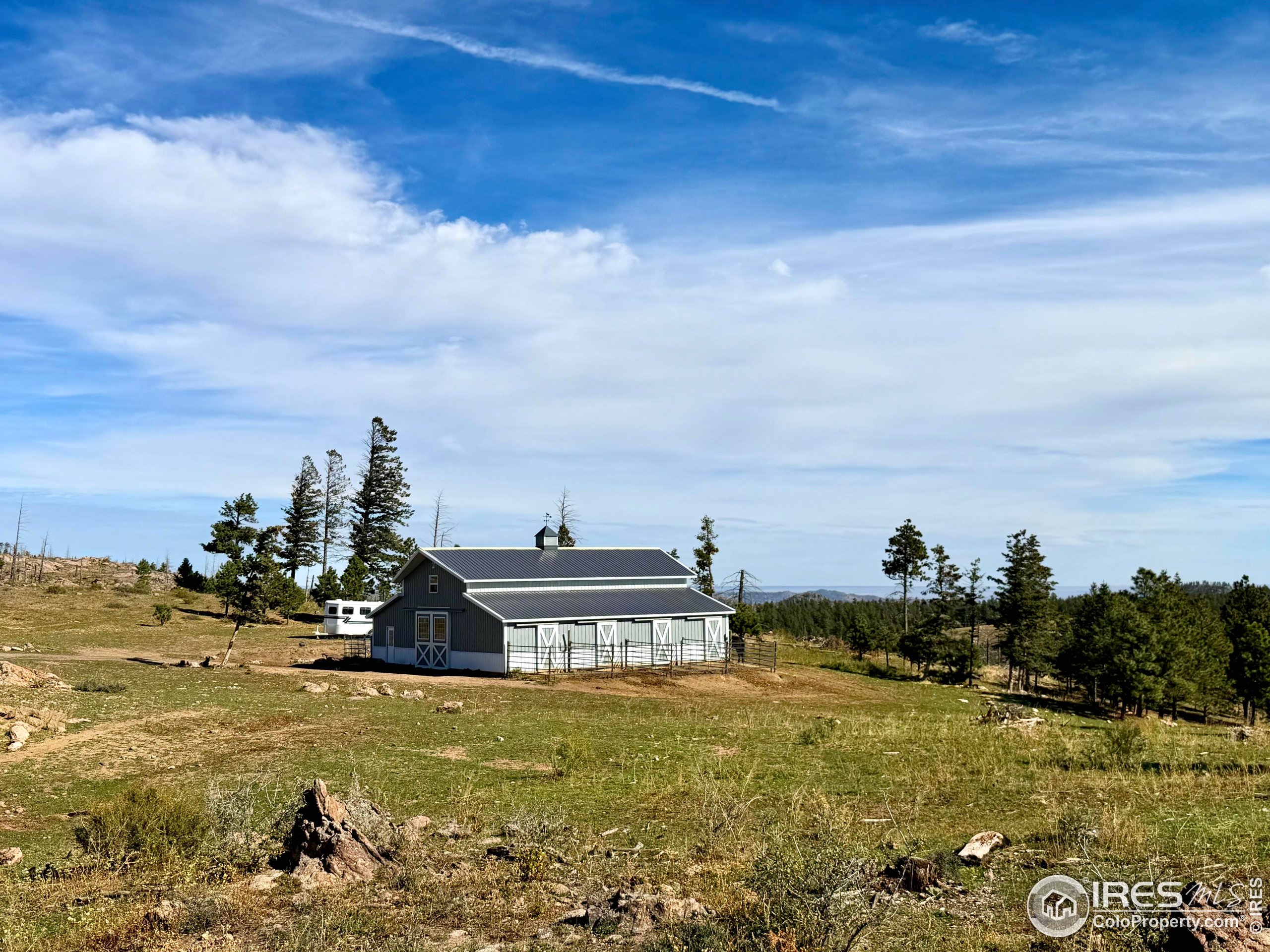 3235 Davis Ranch Road Bellvue, CO 80512 - Photo 33 of 38 a view of a large body of water with lots of mountains in the background