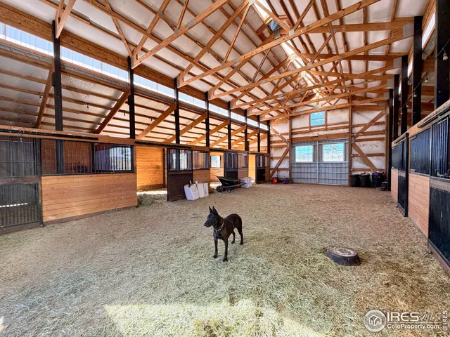 a view of a porch with wooden floor and door