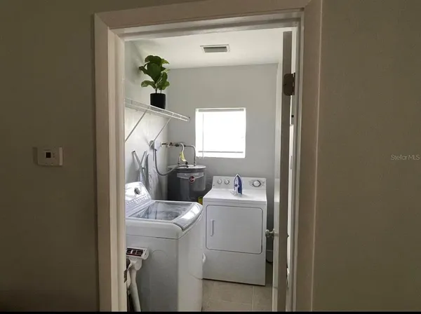 a utility room with dryer and washer
