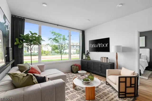 a living room with furniture and a large window