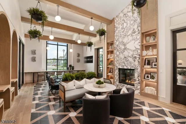 a dining room with furniture a rug and a chandelier