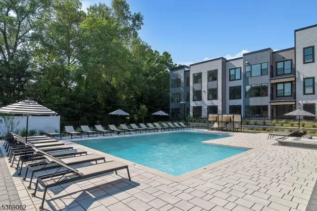 a view of a patio with a table and chairs