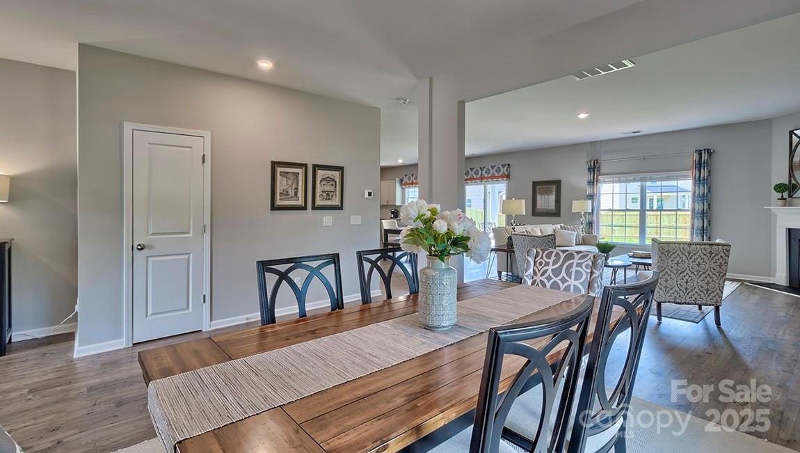 4025 Cramer Estates Gastonia, NC 28056 - Photo 2 of 36 a view of a dining room with furniture and wooden floor