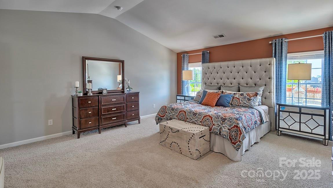 4025 Cramer Estates Gastonia, NC 28056 - Photo 25 of 36 a bedroom with a bed and dresser with mirror