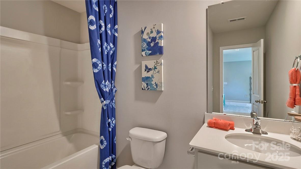 4025 Cramer Estates Gastonia, NC 28056 - Photo 29 of 36 a bathroom with a granite countertop sink toilet and shower