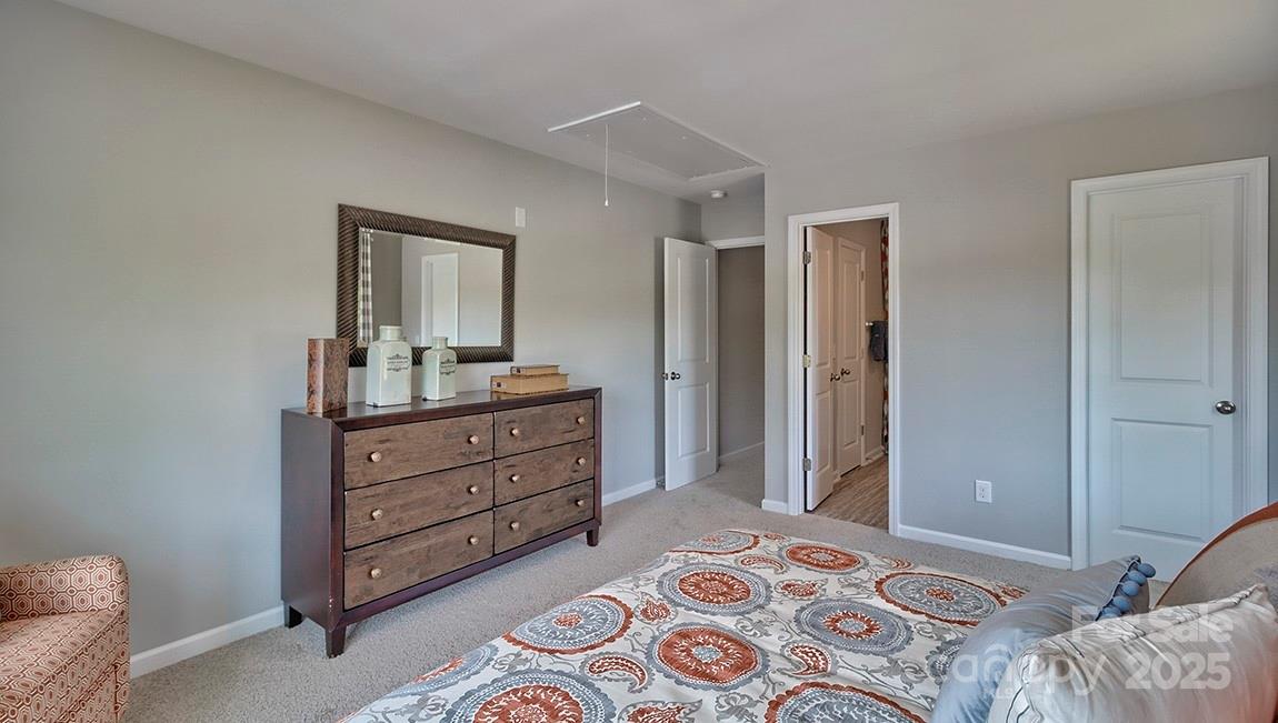 4025 Cramer Estates Gastonia, NC 28056 - Photo 32 of 36 a bedroom with a bed and a dresser in it