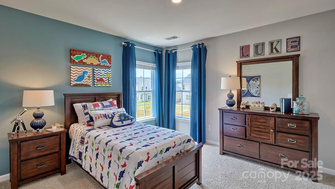 4025 Cramer Estates Gastonia, NC 28056 - Photo 35 of 36 a bedroom with a bed and a dresser in it