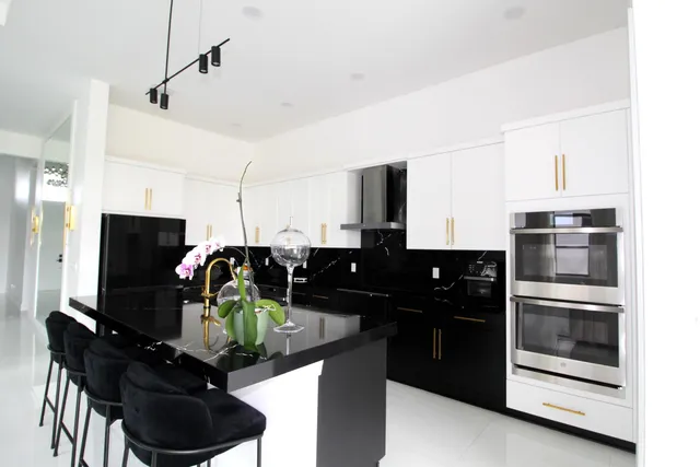 a kitchen with a refrigerator and a sink