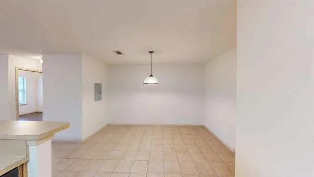 a view of a kitchen with a sink and a chandelier fan