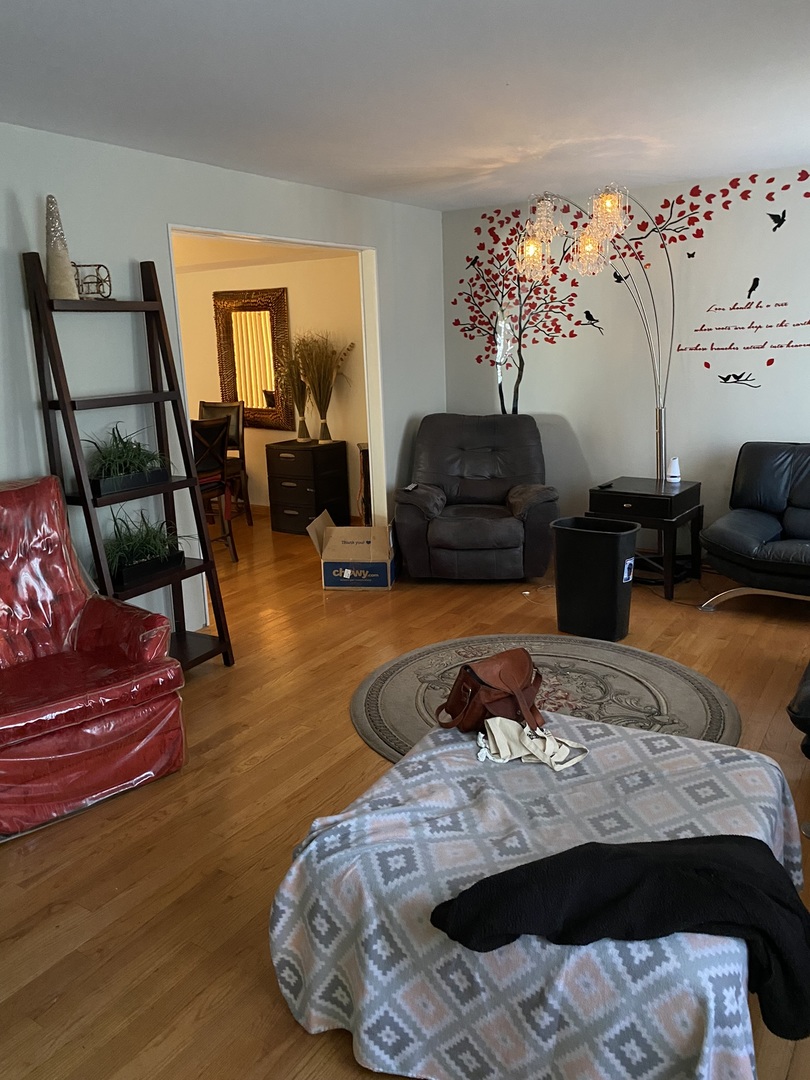 100 Michigan City Road Calumet City, IL 60409 - Photo 2 of 12 a bedroom with a bed couch and a window