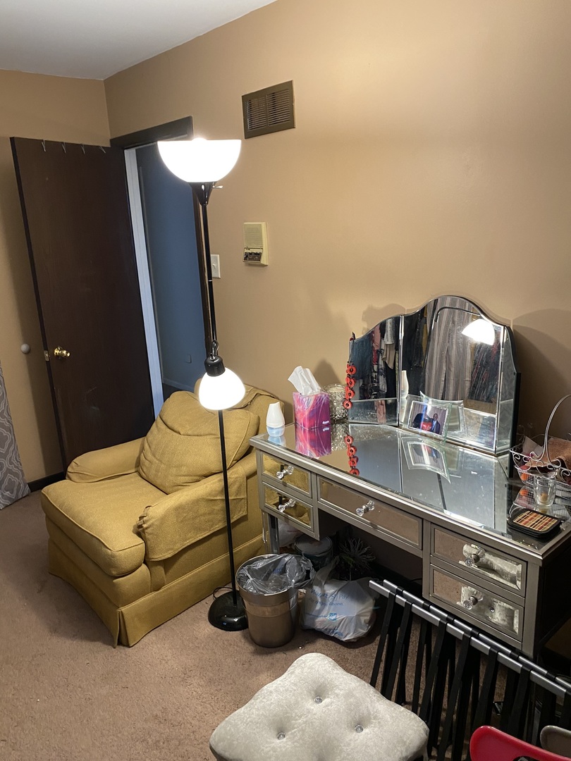 100 Michigan City Road Calumet City, IL 60409 - Photo 7 of 12 a bedroom with furniture and a mirror