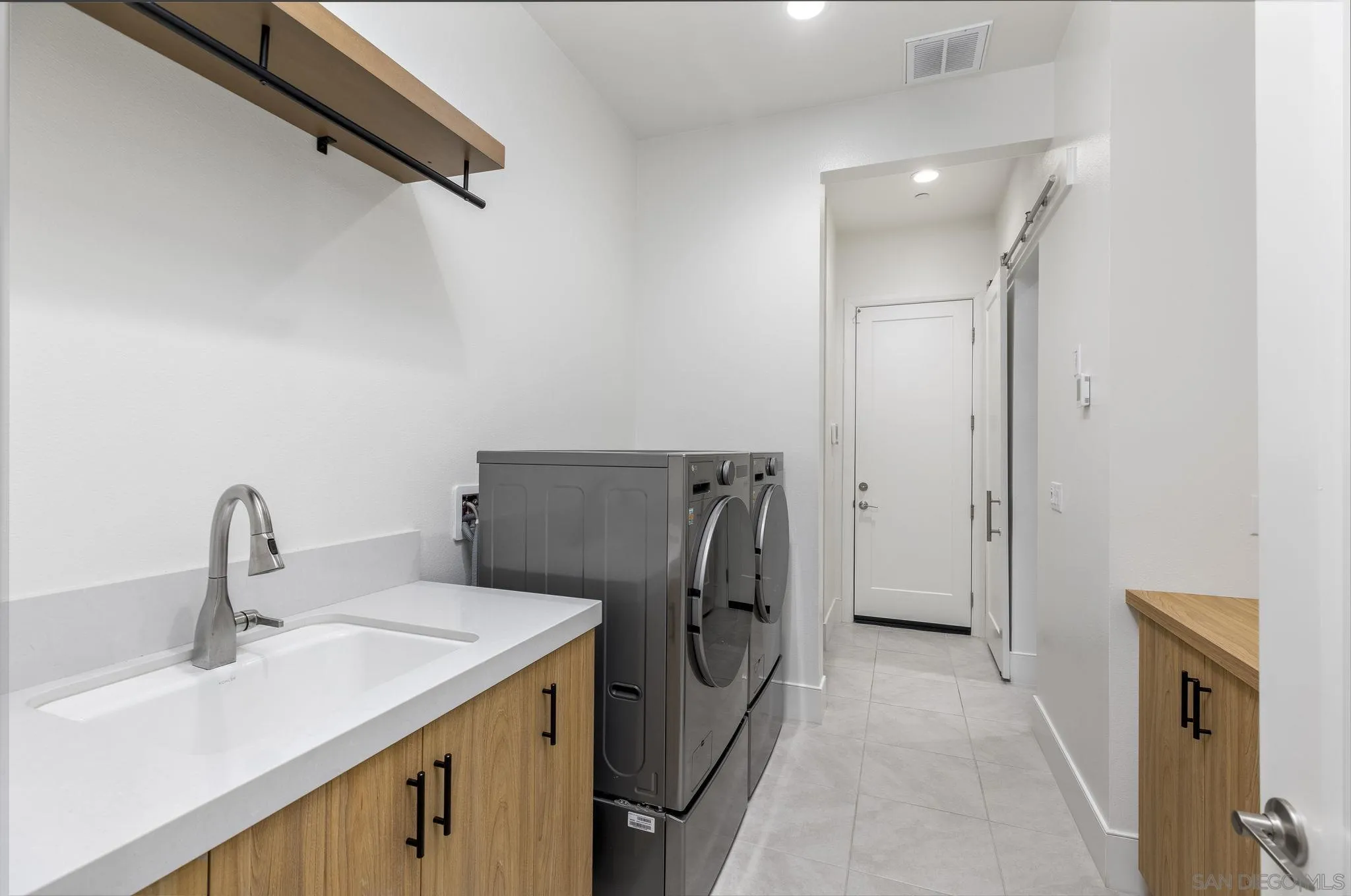 32213 Daybrook Terrace Temecula, CA 92591 - Photo 16 of 23 a kitchen with a sink and refrigerator