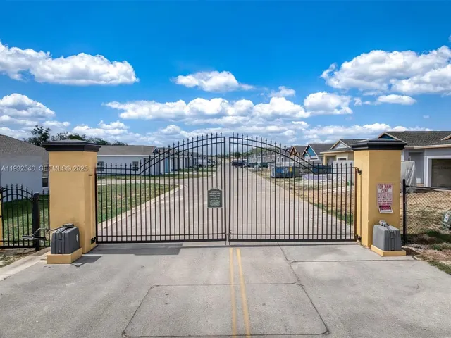 a view of a wrought iron fences in front of house