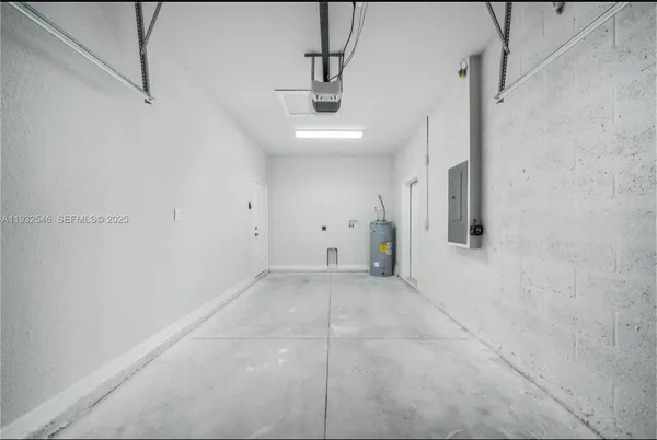 a view of a room with a ceiling fan