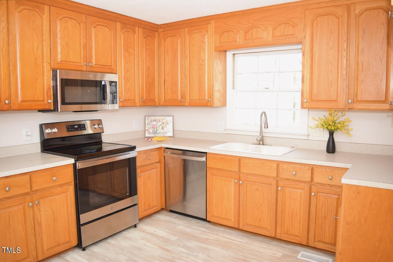 1804 Wall Hill Road Raleigh, NC 27604 - Photo 13 of 24 You won't run out of storage in this kitchen.
