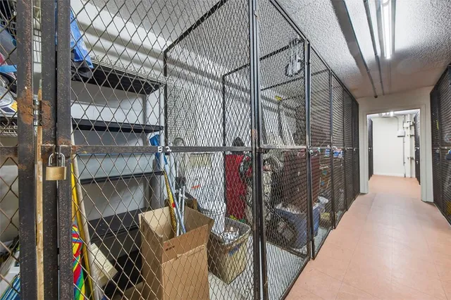 a view of a kitchen with fridge and a sink