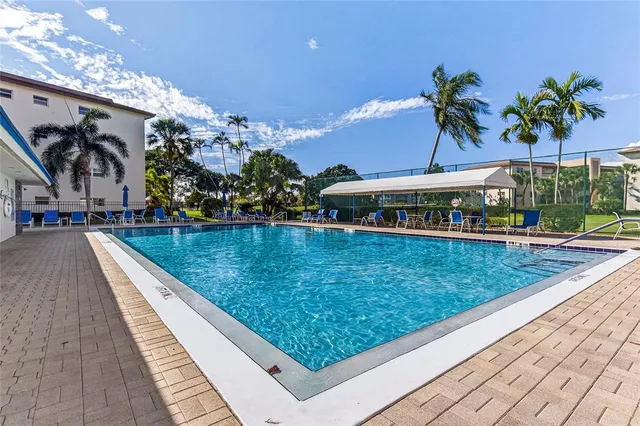 a view of swimming pool with a patio
