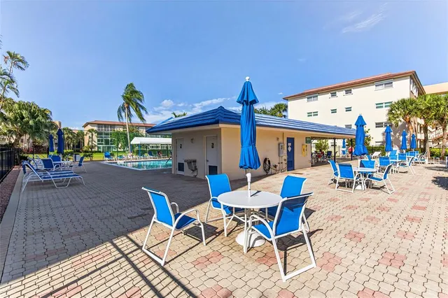 a view of swimming pool with outdoor seating
