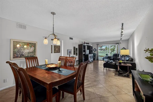 a view of a dining room and livingroom furniture window and wooden floor